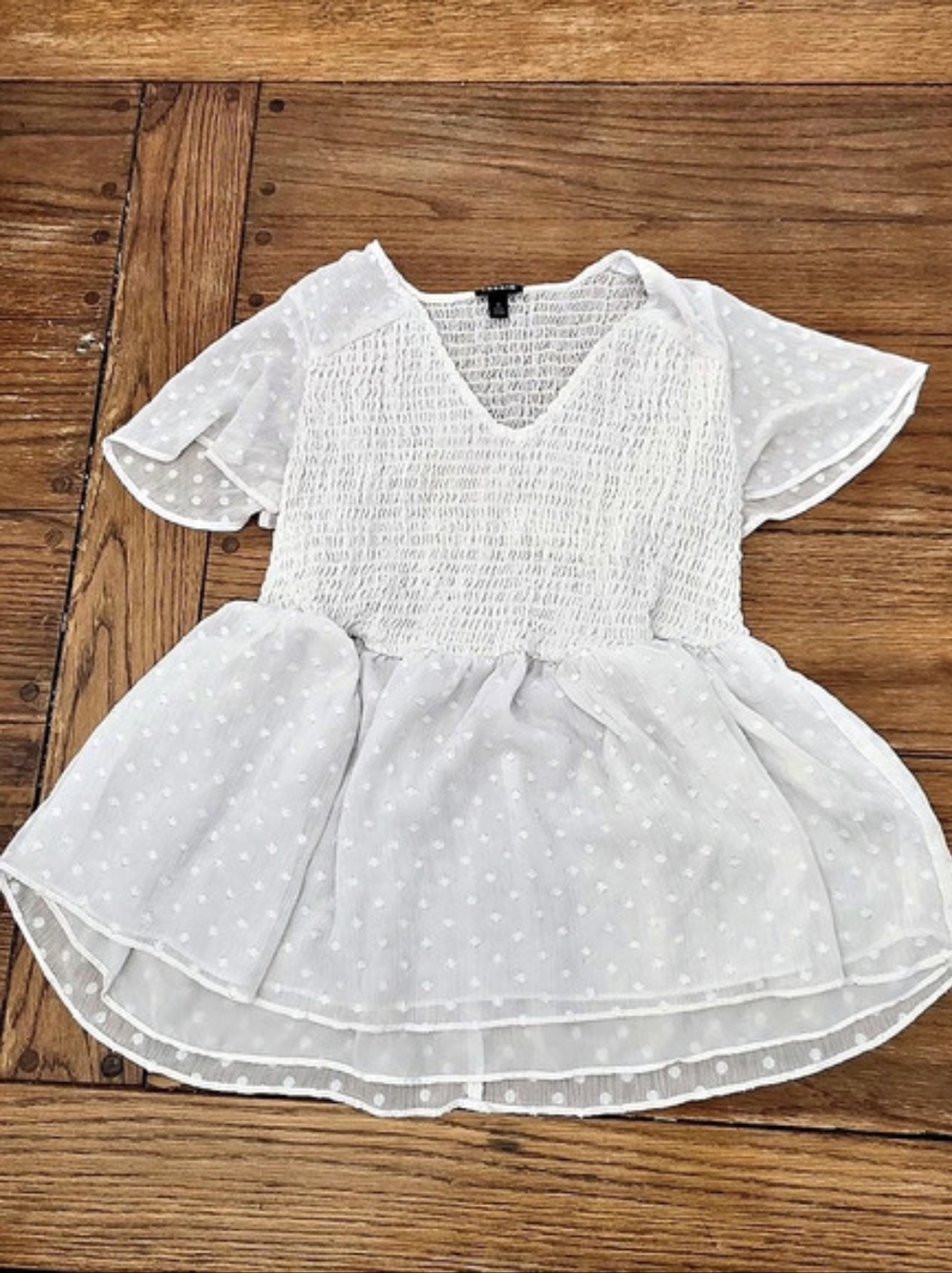 Torrid white clip-dot babydoll peplum blouse